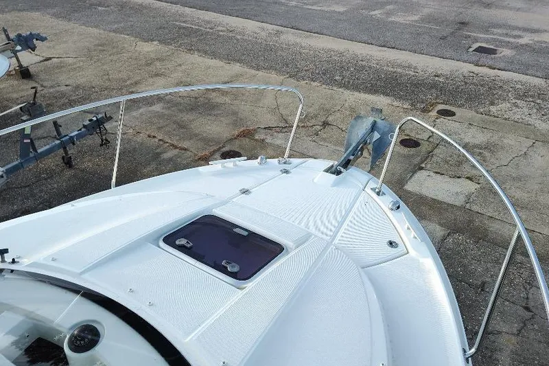 Slide: The Image of 2017 Jeanneau Merry Fisher 795 boat bow with anchor and hatch. - 12