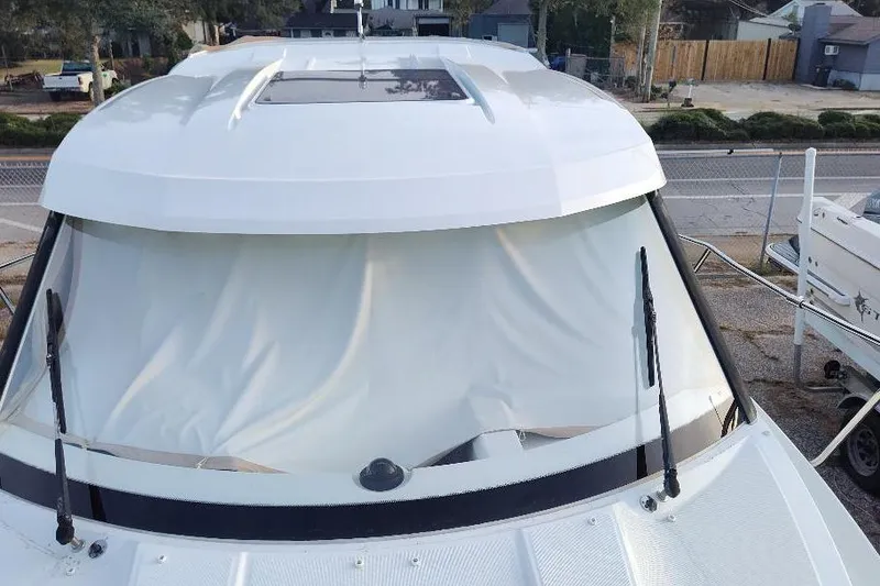 Slide: The Image of 2017 Jeanneau Merry Fisher 795 boat with covered windshield, docked outdoors. - 15