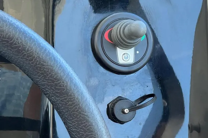 Slide: The Image of Control panel of 2017 Jeanneau Merry Fisher 795 boat with joystick and power button. - 26