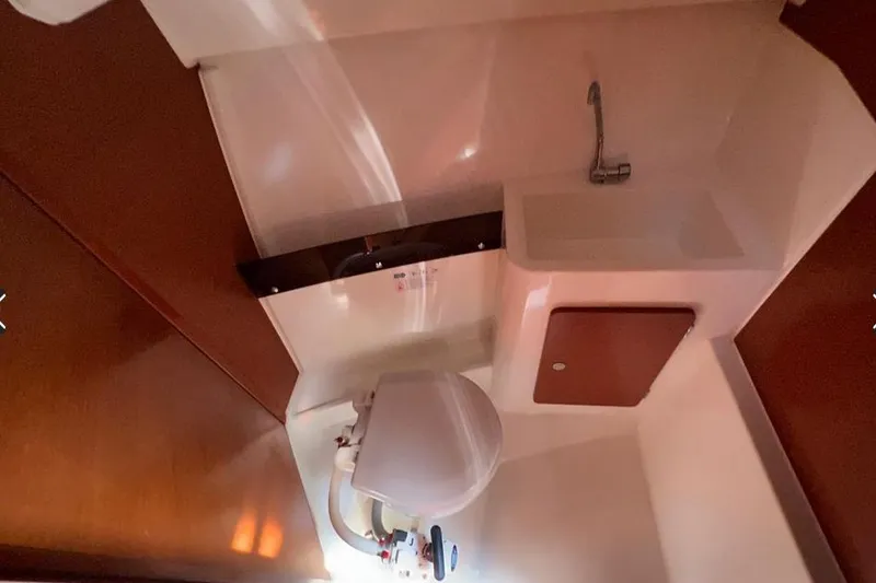 Slide: The Image of Interior of 2017 Jeanneau Merry Fisher 795 boat bathroom with sink and toilet. - 27