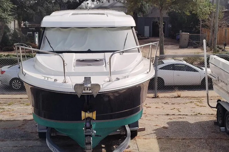 Slide: The Image of 2017 Jeanneau Merry Fisher 795 boat on trailer, parked outdoors. - 7
