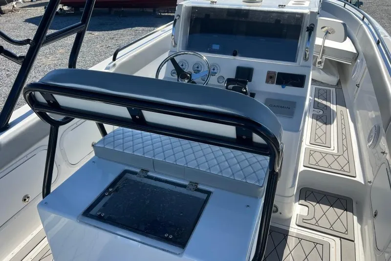 Slide: The Image of 2006 Dakota 36 Open boat interior with steering console and seating. - 14