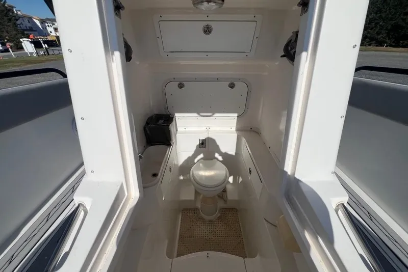 Slide: The Image of Interior of 2006 Dakota 36 Open boat showing compact bathroom facilities. - 21