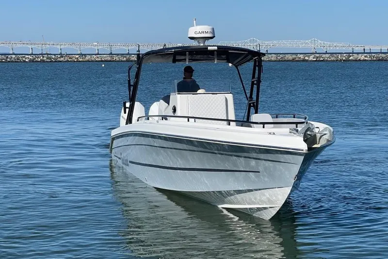 Slide: The Image of 2006 Dakota 36 Open boat on water with bridge in background. - 3