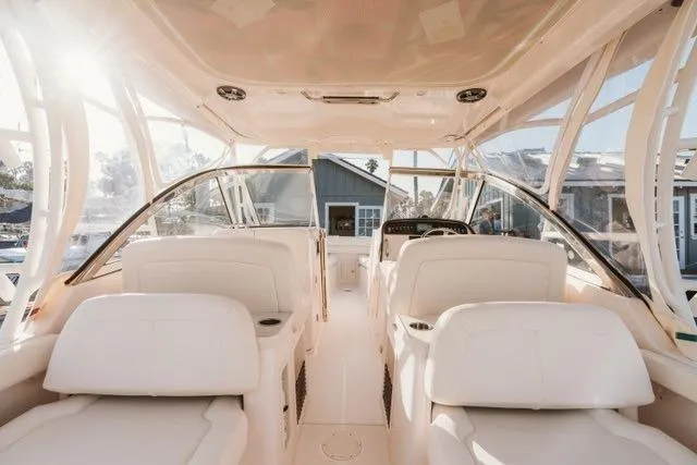 Slide: The Image of Interior view of 2021 Grady-White Freedom 307 boat with white seating and clear windows. - 4