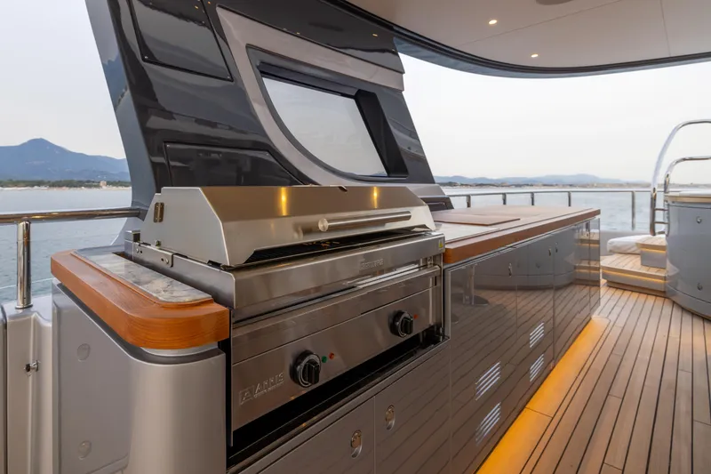Slide: The Image of Luxury outdoor kitchen on 2024 Benetti Oasis 34M yacht with scenic ocean view. - 12