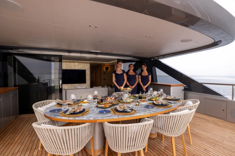 Slide: The Image of Luxury dining setup on 2024 Benetti Oasis 34M yacht with crew. - 15