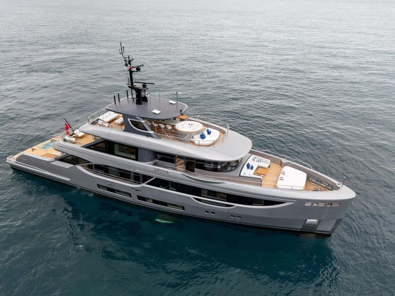 Slide: The Image of 2024 Benetti Oasis 34M Co Ownership yacht on open water, aerial view. - 2