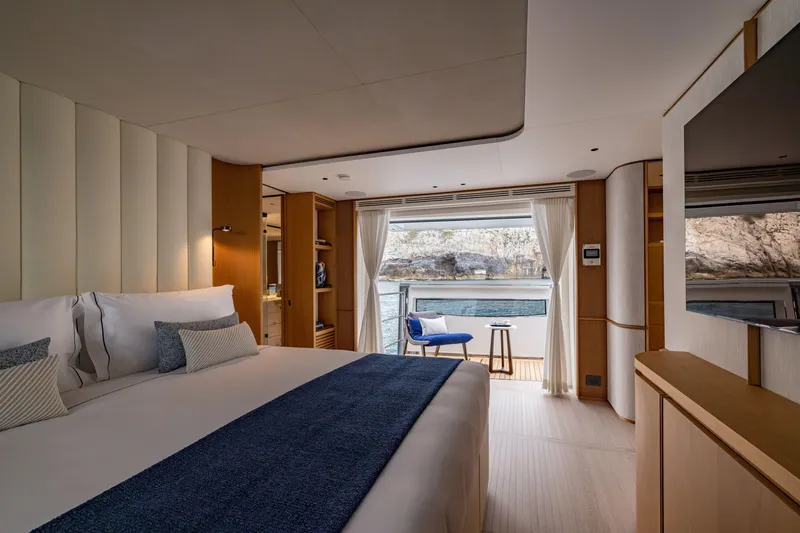 Slide: The Image of Luxurious bedroom in 2024 Benetti Oasis 34M yacht, featuring elegant decor and scenic ocean view. - 26