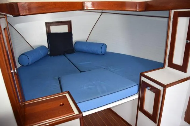 Slide: The Image of Open V-berth with filler cushion, wood trim - 25