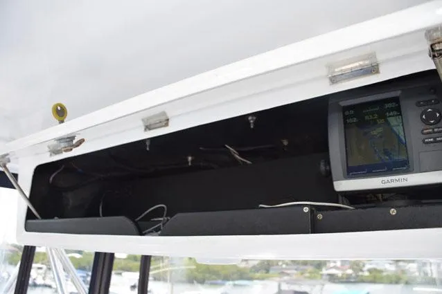 Slide: The Image of Overhead electronics box with backup Garmin - 12