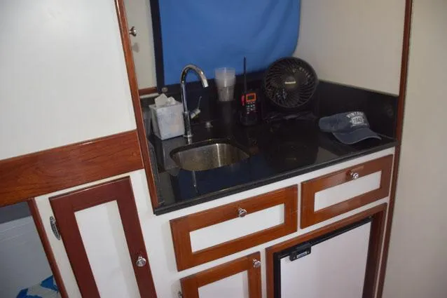 Slide: The Image of Galley with granite countertop, stainless sink - 23