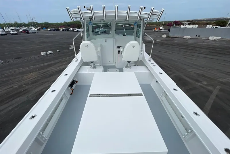 Slide: The Image of 2026 Steiger Craft 28 Hawaii boat, spacious deck, dual seats, docked in a marina. - 11