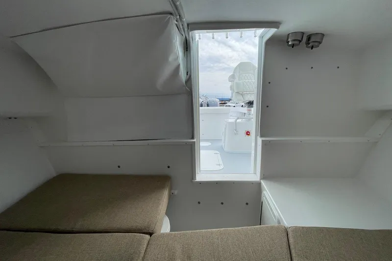 Slide: The Image of Interior view of 2026 Steiger Craft 28 Hawaii boat, featuring seating and open deck access. - 17