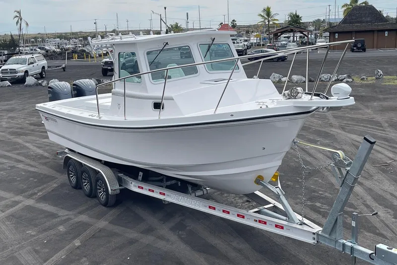 Slide: The Image of 2026 Steiger Craft 28 Hawaii boat on trailer in parking lot. - 5