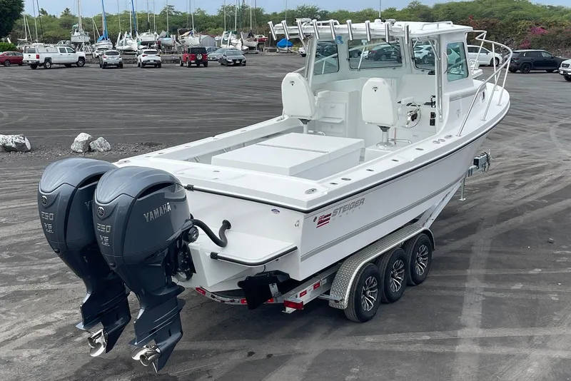 Slide: The Image of 2026 Steiger Craft 28 Hawaii boat with dual Yamaha engines on a trailer. - 8
