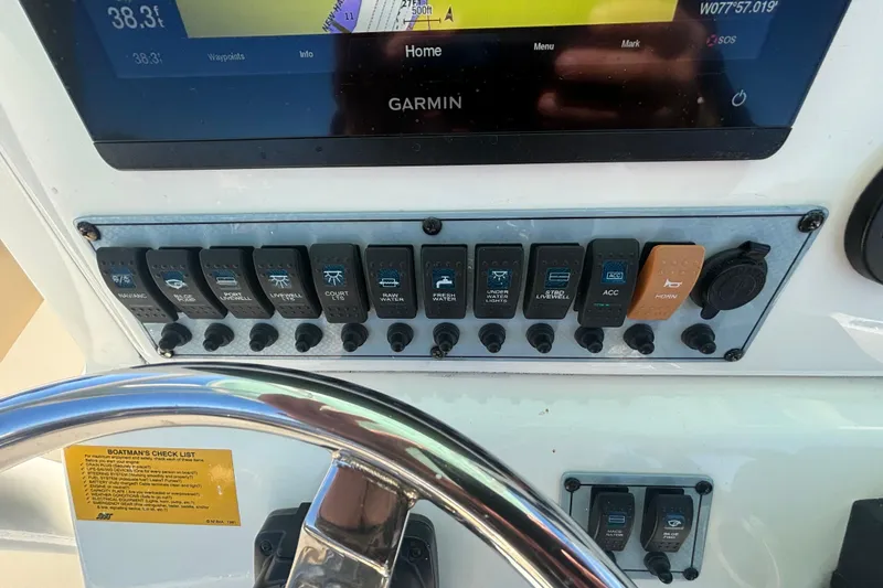 Slide: The Image of Control panel of a 2019 Key West 244 Center Console boat with Garmin display. - 13