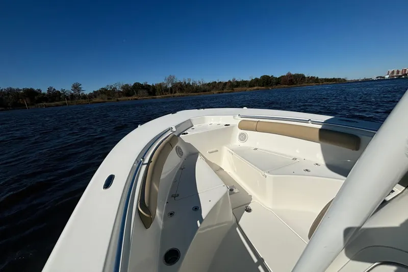Slide: The Image of 2019 Key West 244 Center Console boat on calm water under clear blue sky. - 17