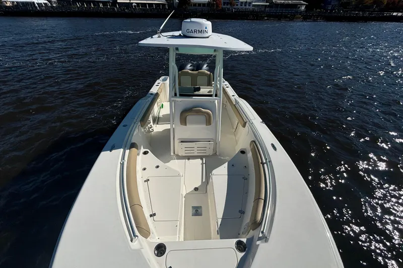 Slide: The Image of 2019 Key West 244 Center Console boat on water, featuring Garmin equipment. - 19