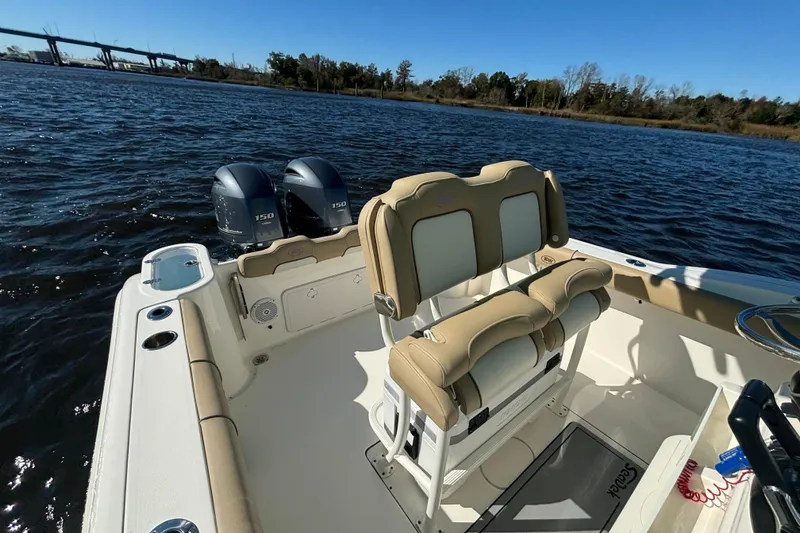 Slide: The Image of 2019 Key West 244 Center Console boat on water, featuring dual engines and comfortable seating. - 21