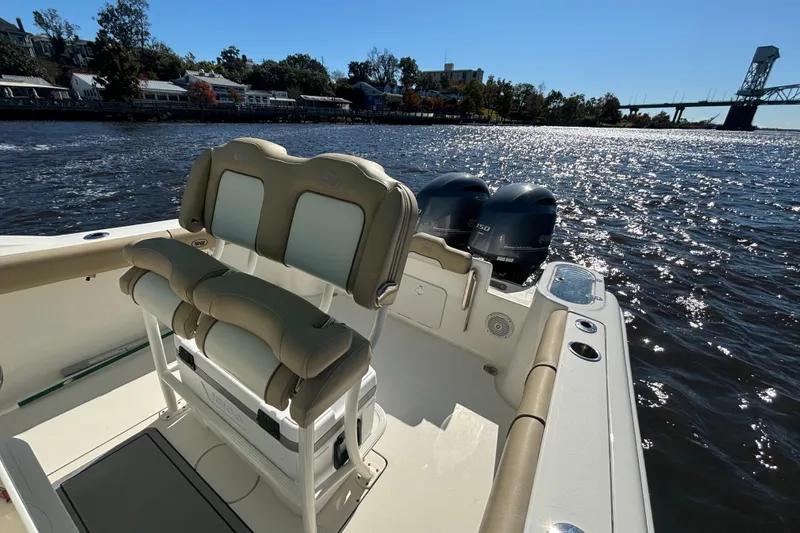 Slide: The Image of 2019 Key West 244 Center Console boat on a sunny river with dual engines. - 24