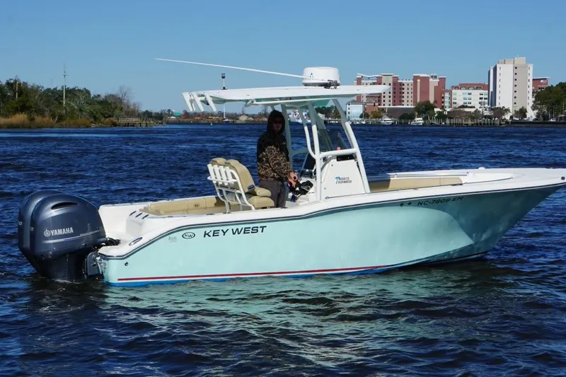 Slide: The Image of 2019 Key West 244 Center Console boat on water with Yamaha engine. - 29