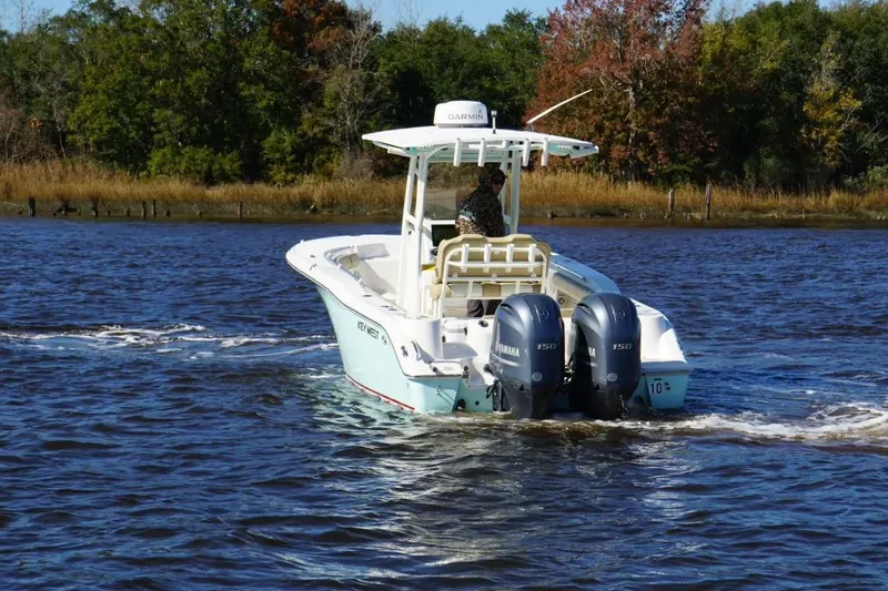 Slide: The Image of 2019 Key West 244 Center Console boat cruising on a scenic river. - 8