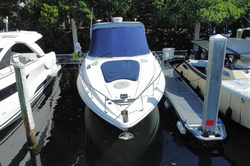 Slide: The Image of 2007 Cruisers Yachts 370 Express docked at marina, front view. - 18