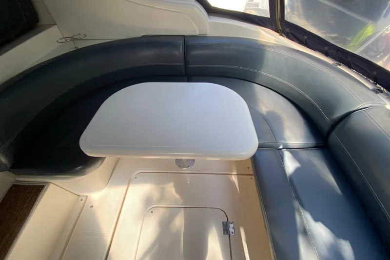 Slide: The Image of 2007 Cruisers Yachts 370 Express interior with curved seating and table. - 24
