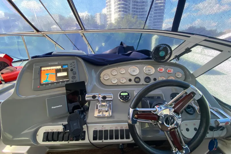 Slide: The Image of 2007 Cruisers Yachts 370 Express helm with navigation system and controls. - 30
