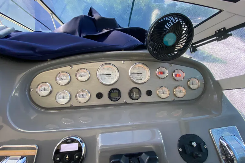 Slide: The Image of 2007 Cruisers Yachts 370 Express dashboard with gauges and fan. - 32