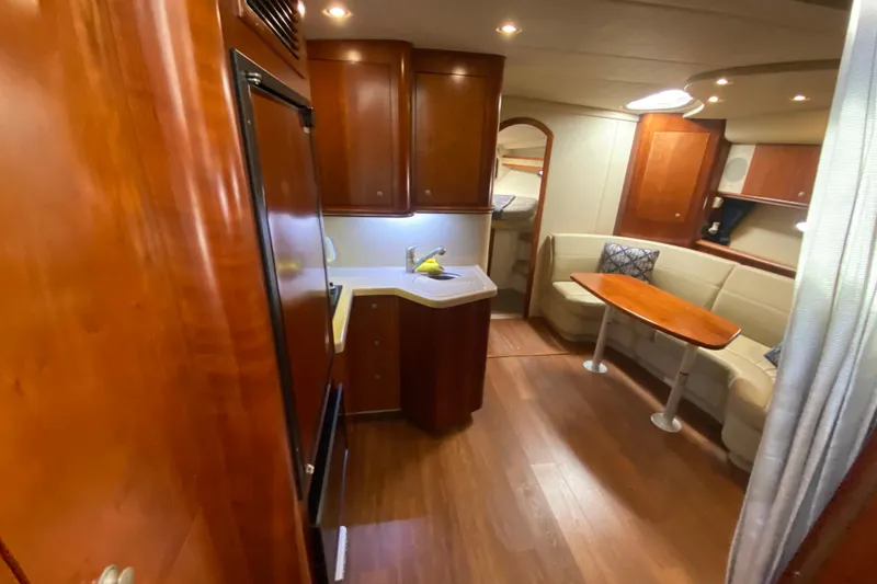 Slide: The Image of Luxurious 2007 Cruisers Yachts 370 Express interior with kitchen and seating area. - 36
