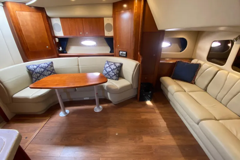 Slide: The Image of Luxurious interior of 2007 Cruisers Yachts 370 Express with leather seating and wooden table. - 41