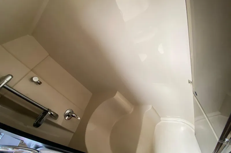 Slide: The Image of 2007 Cruisers Yachts 370 Express bathroom interior with sleek fixtures and modern design. - 50