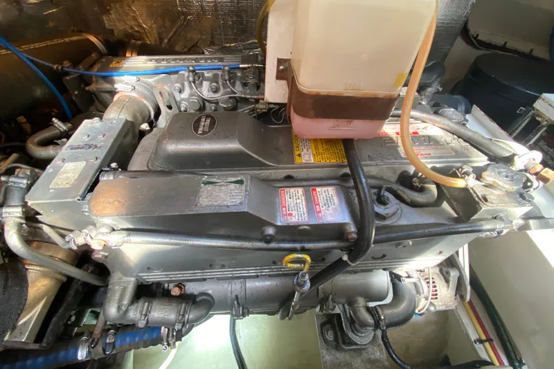 Slide: The Image of Engine compartment of a 2007 Cruisers Yachts 370 Express, showcasing mechanical components. - 53