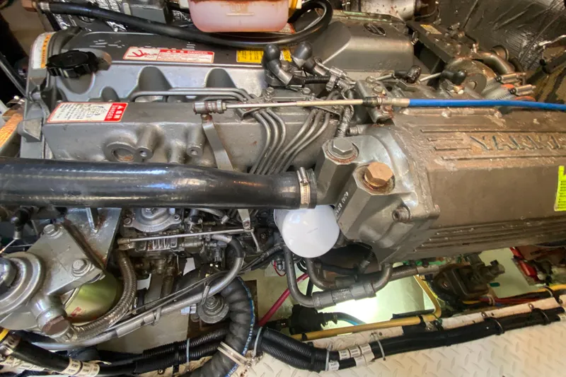 Slide: The Image of Engine compartment of a 2007 Cruisers Yachts 370 Express, showcasing detailed mechanical components. - 55