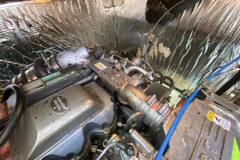 Slide: The Image of Engine compartment of a 2007 Cruisers Yachts 370 Express, featuring a Yanmar diesel engine. - 56