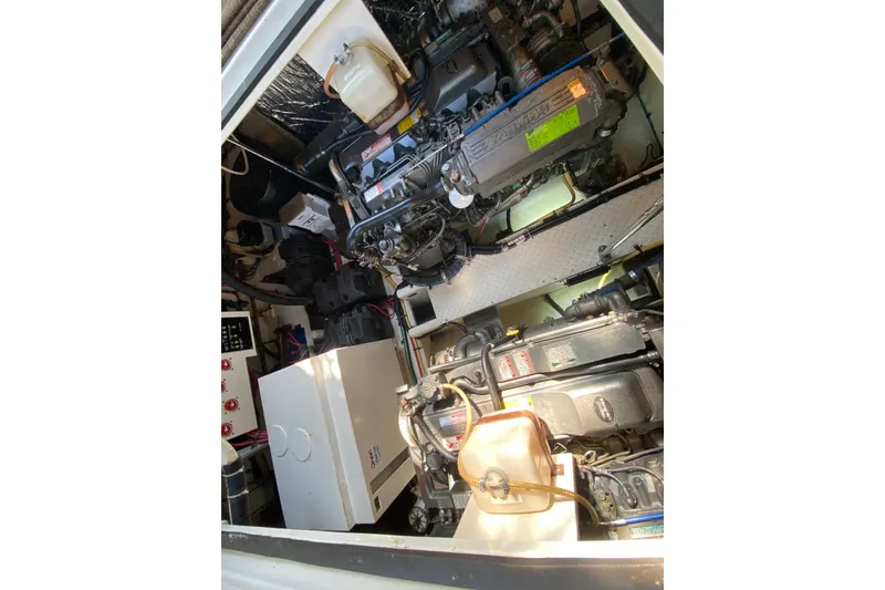 Slide: The Image of Engine room of 2007 Cruisers Yachts 370 Express, showcasing mechanical components. - 59