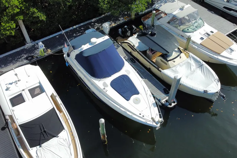 Slide: The Image of 2007 Cruisers Yachts 370 Express docked among other boats in a marina. - 6