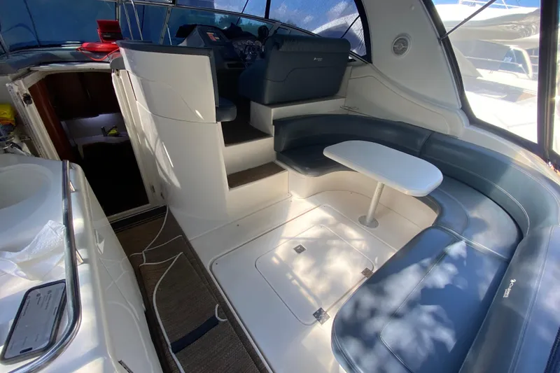Slide: The Image of 2007 Cruisers Yachts 370 Express interior with seating and table, showcasing luxury design. - 21