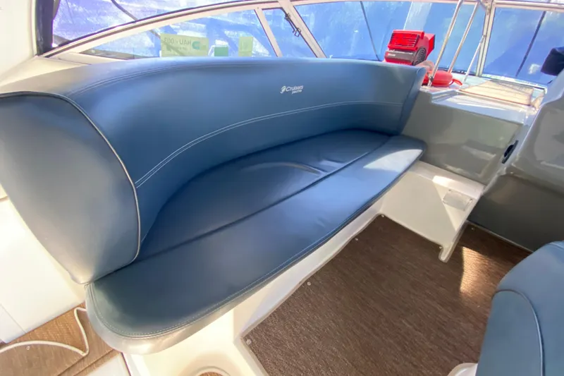 Slide: The Image of 2007 Cruisers Yachts 370 Express interior with blue seating and modern design. - 26