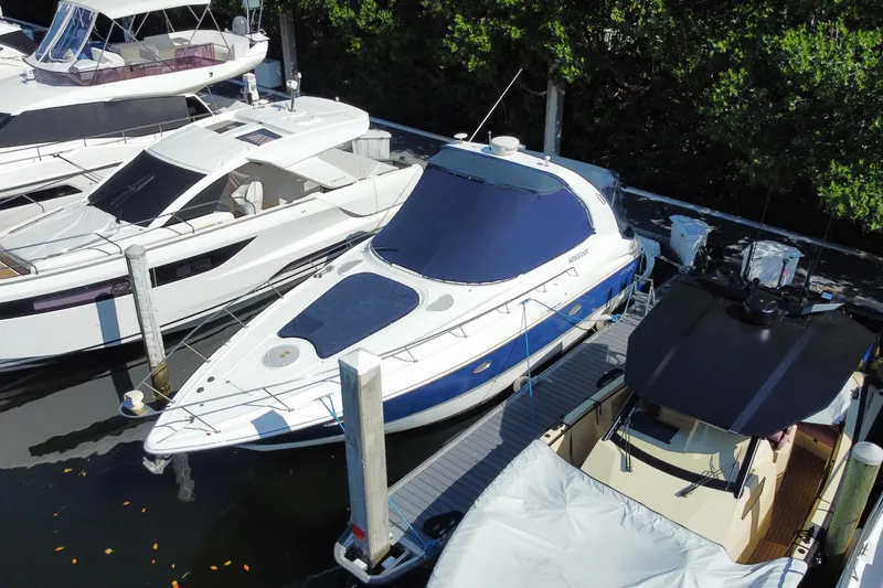 Slide: The Image of 2007 Cruisers Yachts 370 Express docked among other boats in a marina. - 3