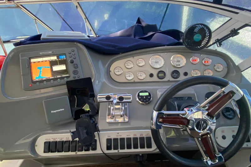 Slide: The Image of 2007 Cruisers Yachts 370 Express helm with navigation system and control panel. - 31