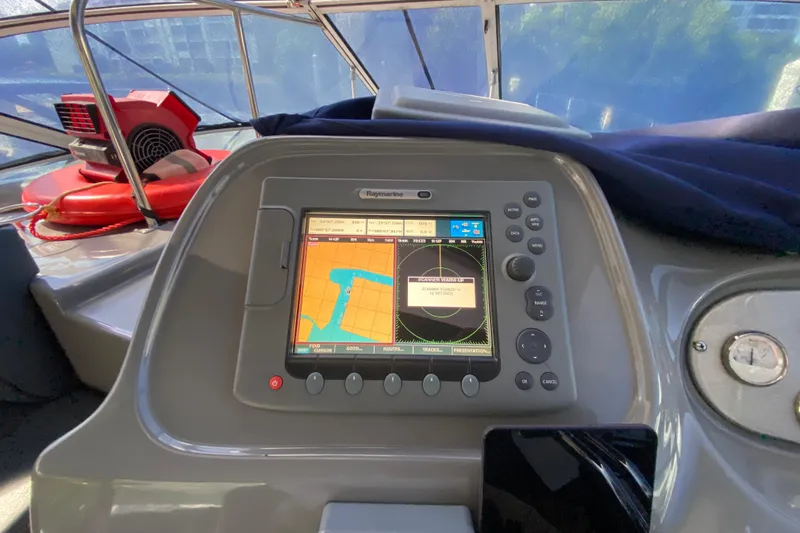 Slide: The Image of 2007 Cruisers Yachts 370 Express navigation system with Raymarine display and controls. - 33