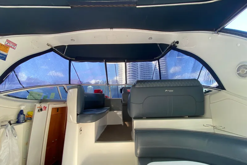 Slide: The Image of Interior of a 2007 Cruisers Yachts 370 Express with blue seating and canopy. - 34