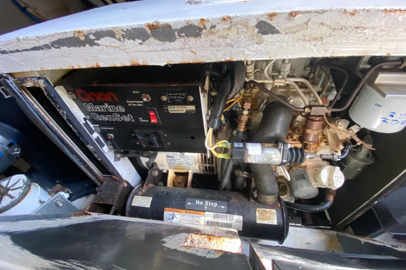 Slide: The Image of Engine compartment of a 2007 Cruisers Yachts 370 Express with Onan Marine GenSet. - 51
