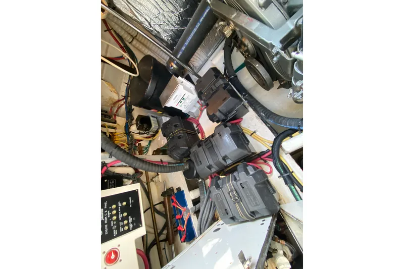 Slide: The Image of Engine compartment of 2007 Cruisers Yachts 370 Express with wiring and components. - 52