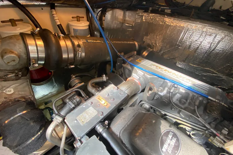 Slide: The Image of Engine compartment of a 2007 Cruisers Yachts 370 Express, featuring a Yanmar diesel engine. - 58