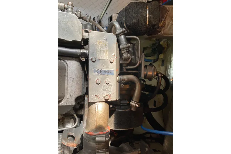 Slide: The Image of Engine compartment of a 2007 Cruisers Yachts 370 Express, showcasing mechanical components. - 62