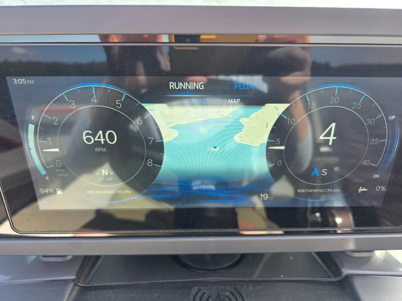 Slide: The Image of Bennington 24MSL-ESP TRI 2026 dashboard with tachometer and map display. - 10